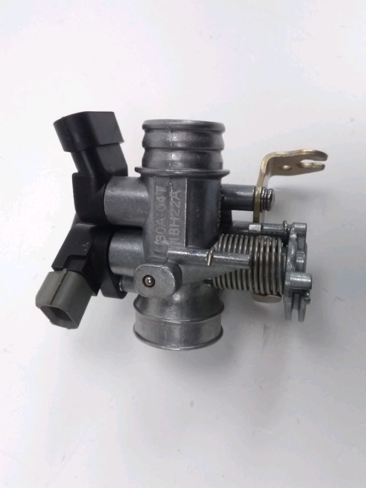 Corps d'injection gauche