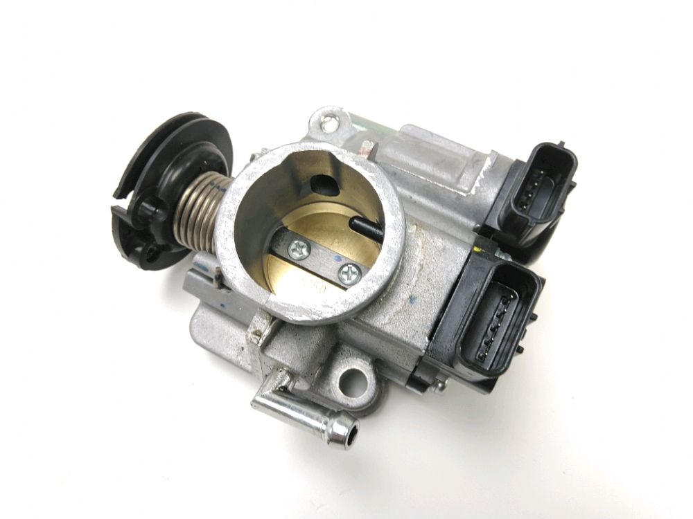 Corps d'injection gauche